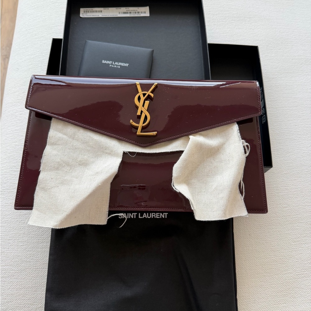 Saint Laurent Glossy Maroon Clutch with Gold Logo